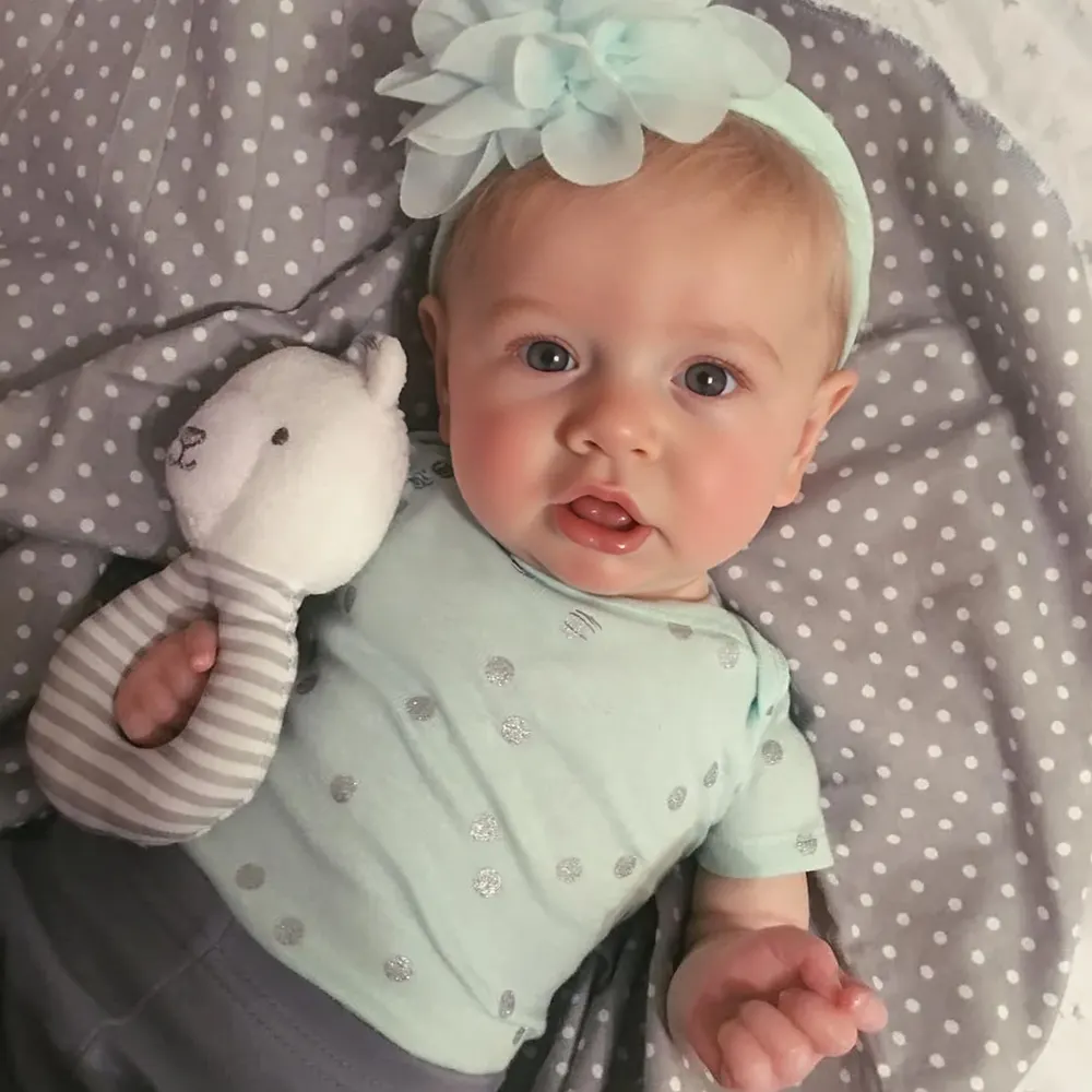 A reborn baby doll dressed and ready to be posted